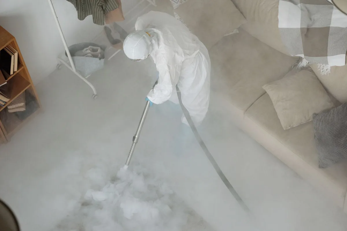 Biohazard cleanup technician in protective equipment, Howard, WI